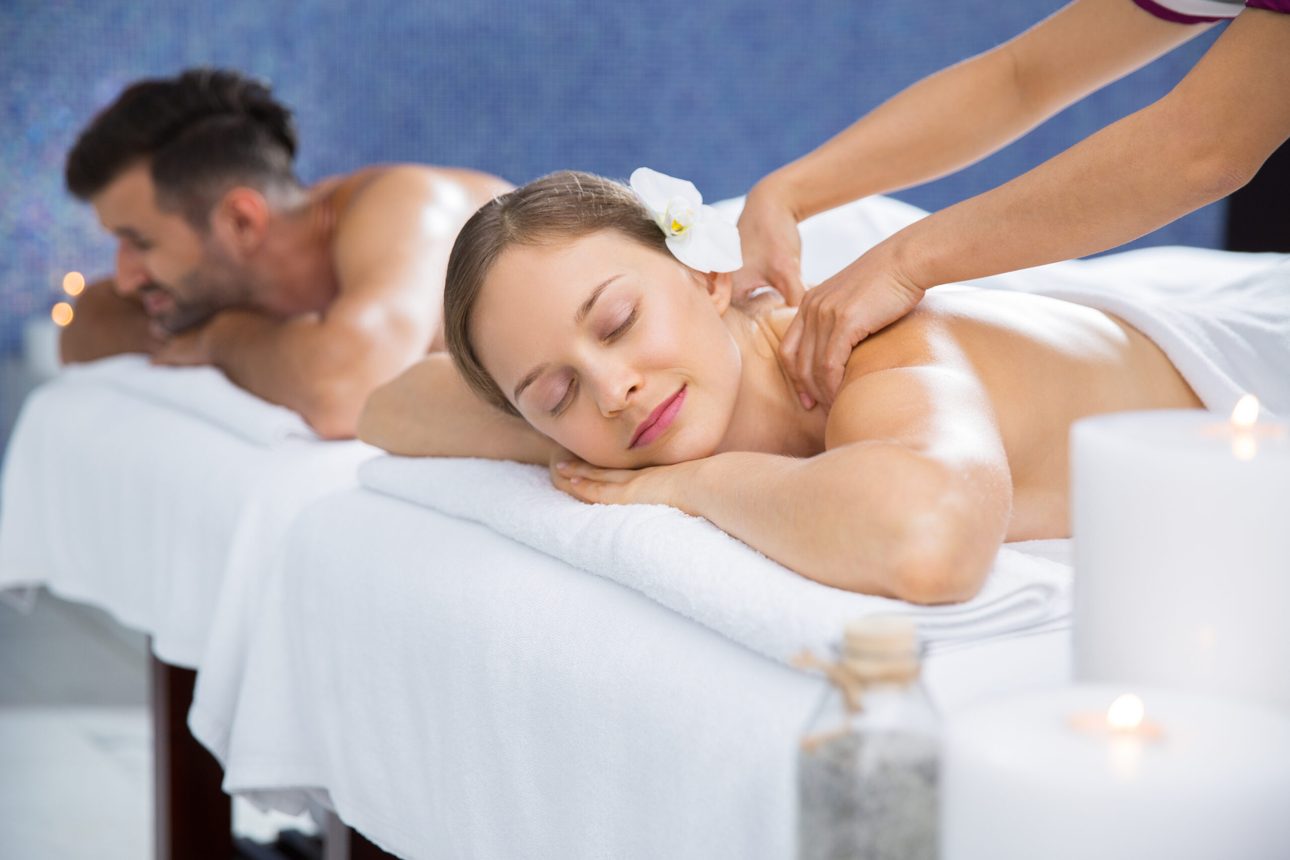 couple getting massage together in spa center